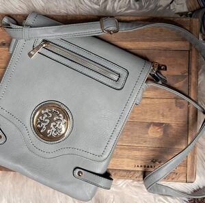 Elegant Gray Crossbody Bag with Gold Detailing